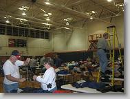 The gym of the school where we distributed heavy winter coats. Everyone's setting up for tomorrow morning.